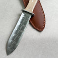 Load image into Gallery viewer, Knife with leather sheath on a light gray background